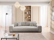 Szara sofa czteroosobowa z funkcją spania