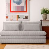 Szara sofa z materacem do spania codziennego i pojemnikiem