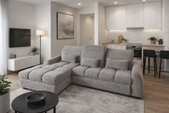 Szara sofa rogowa z funkcją spania z regulacją głębokości siedzisk