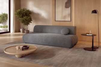 Szara minimalistyczna sofa z funkcją spania