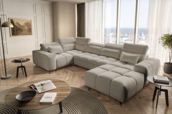 Piękna beżowa i wyszukana sofa podkowa z funkcją spania